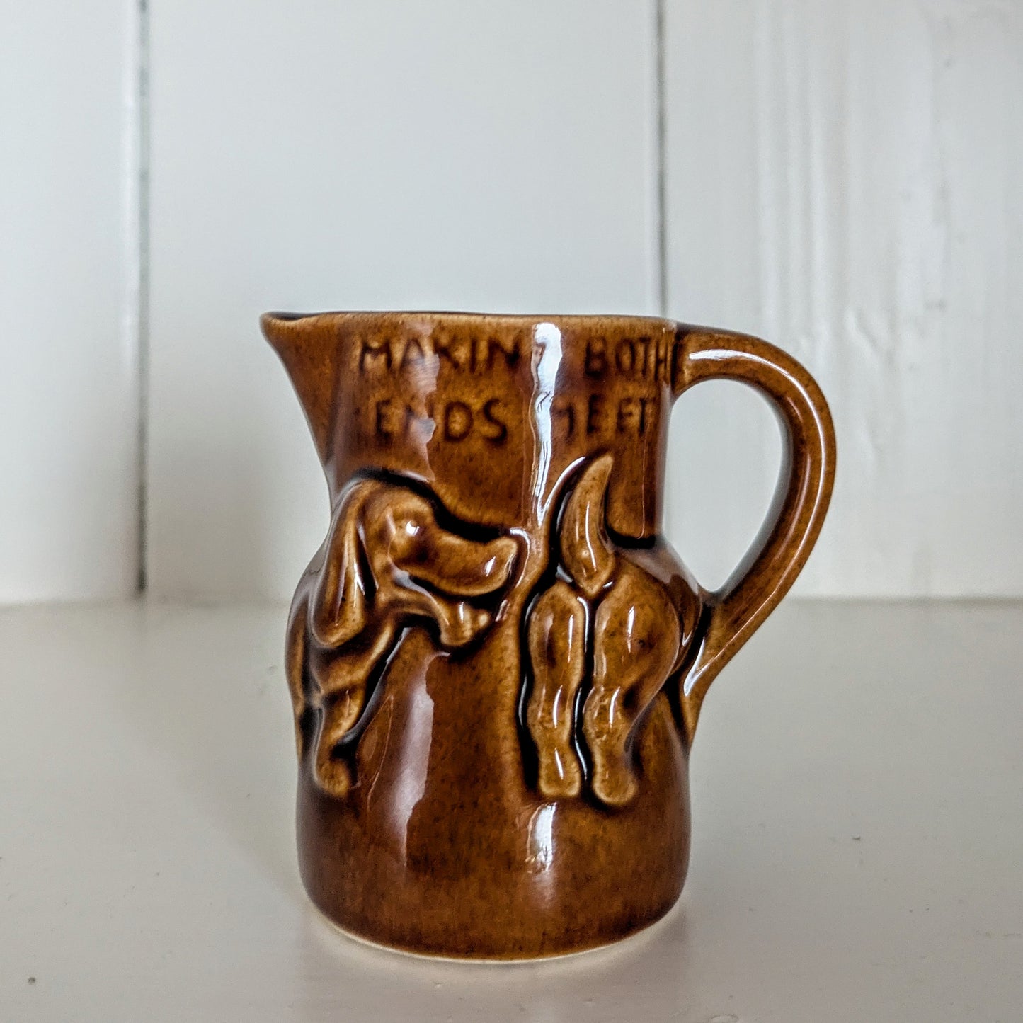 Dachshund Sausage Dog Milk Jug "Making Both Ends Meet" in a Dark Brown Glaze