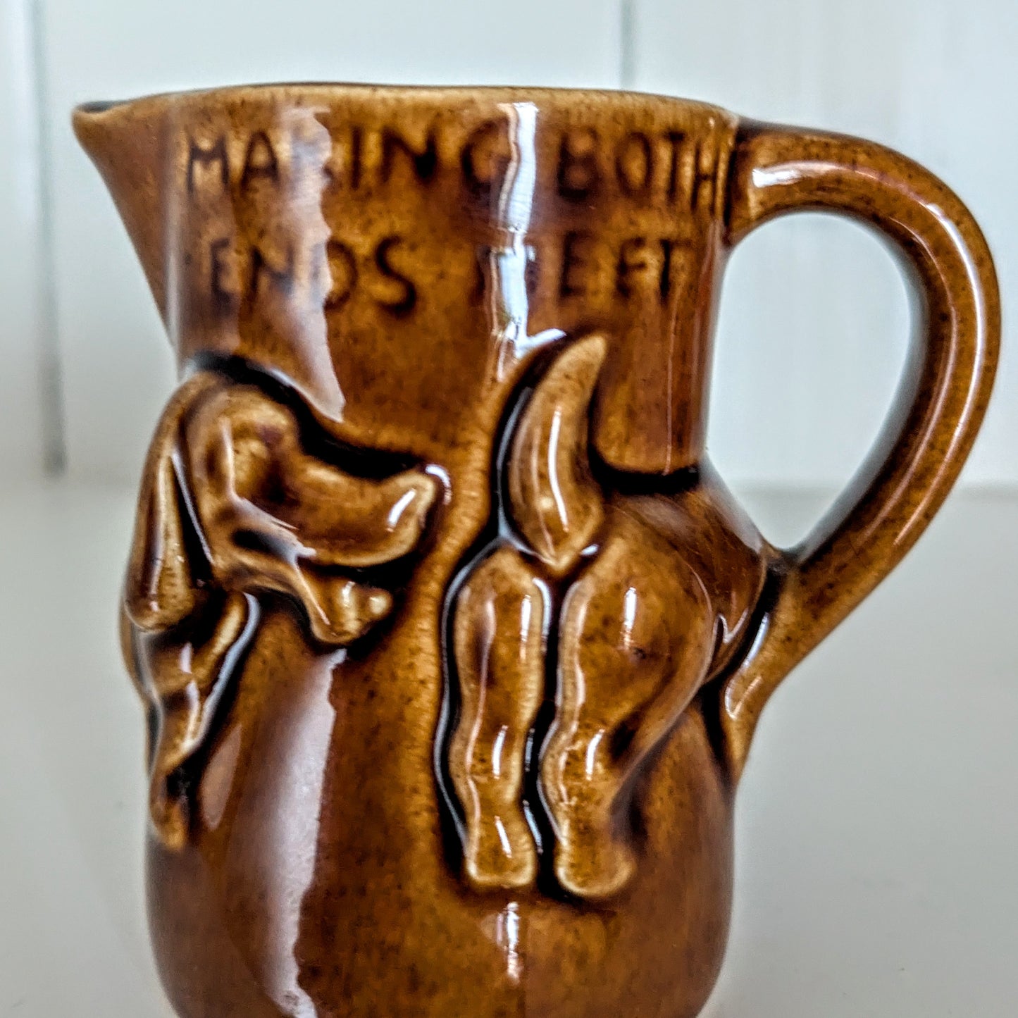 Dachshund Sausage Dog Milk Jug "Making Both Ends Meet" in a Dark Brown Glaze